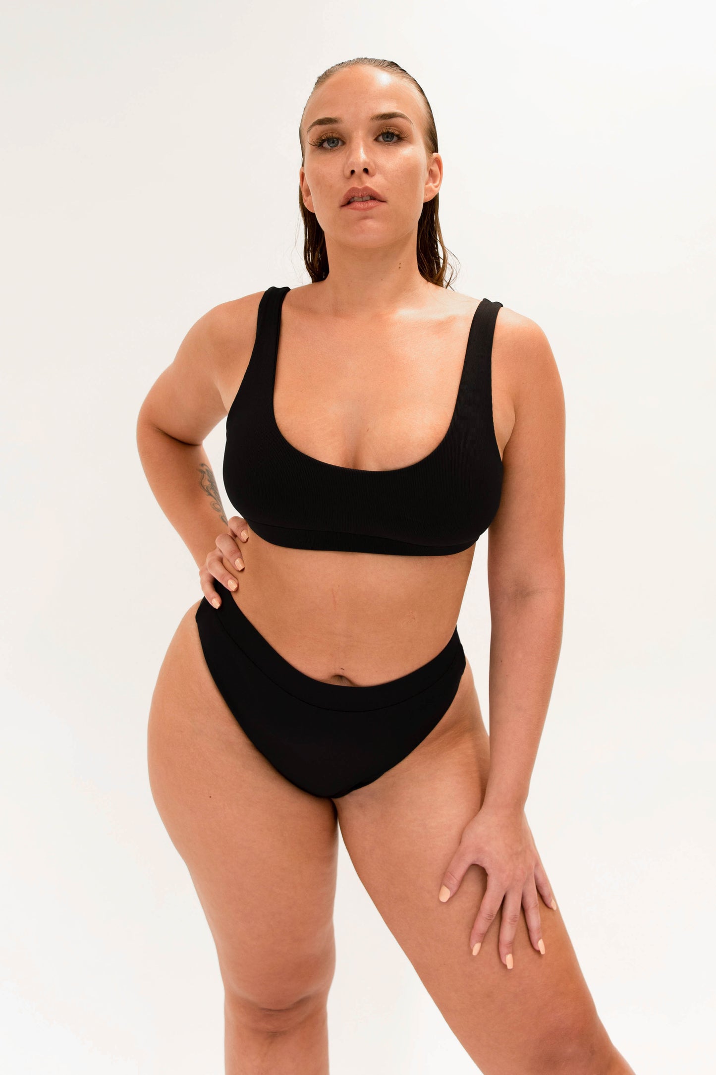 model with sustainable high cut bikini bottom and sporty top