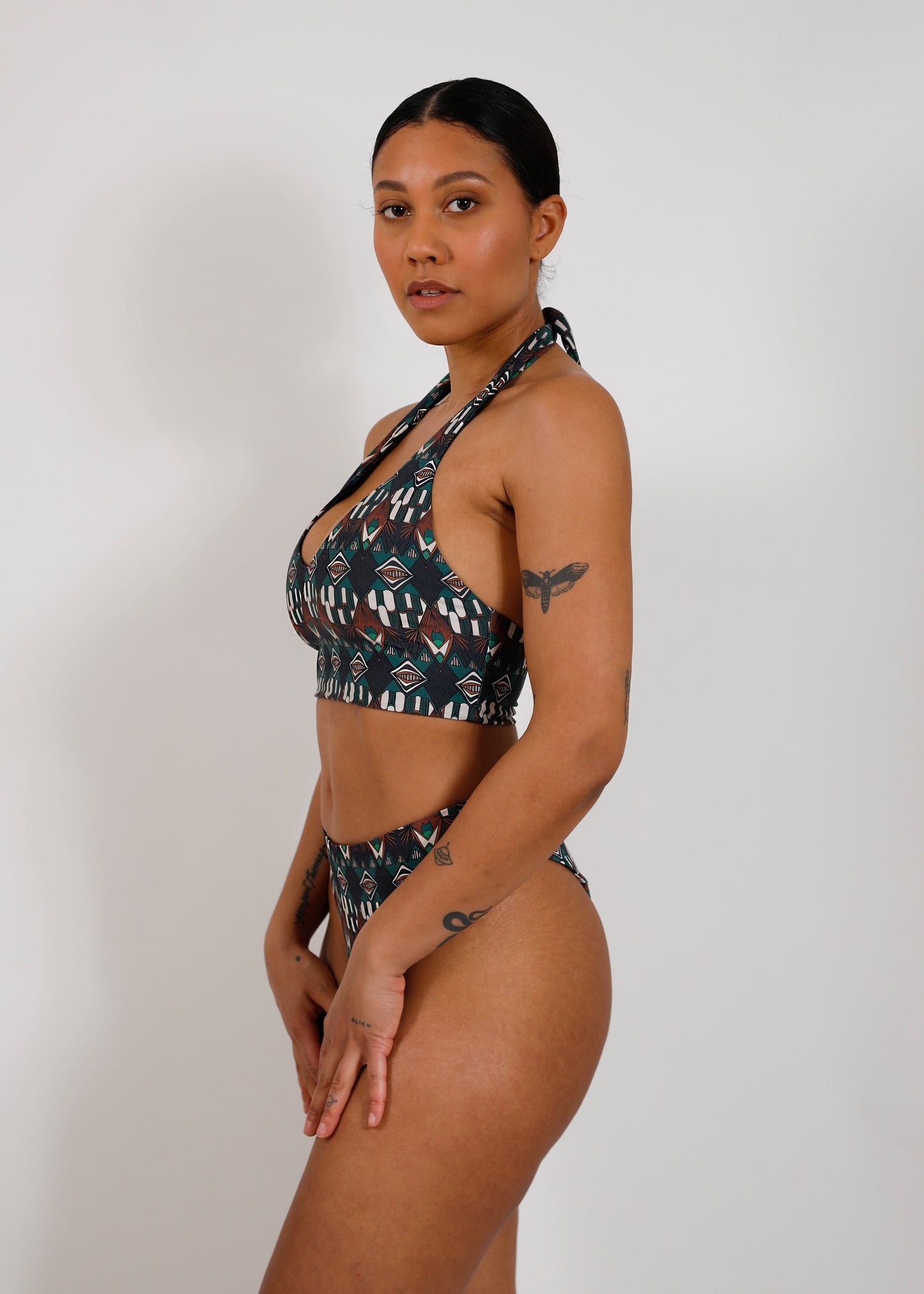 model with sustainable print tieback bikini top