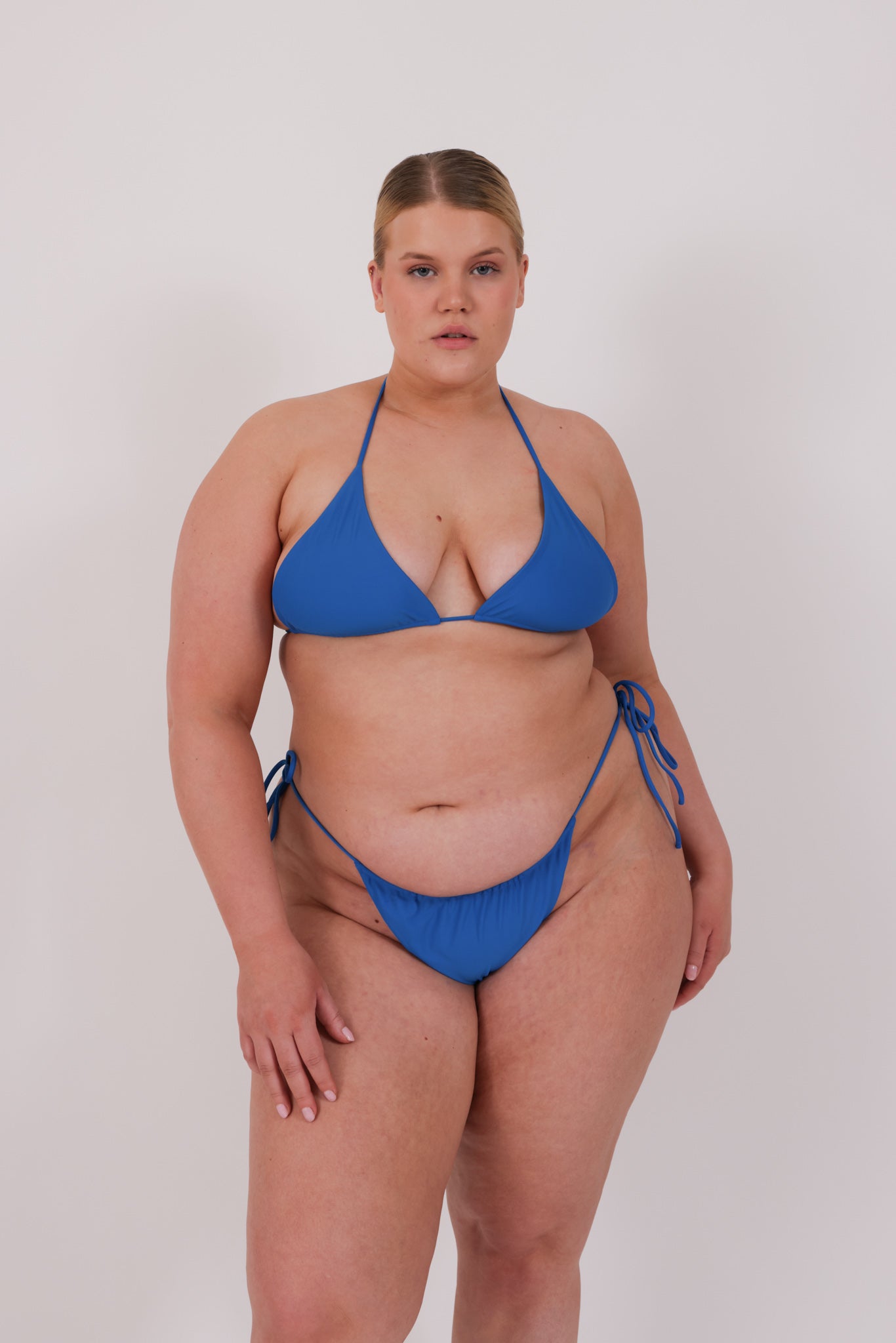 blue string bikini on plus size model