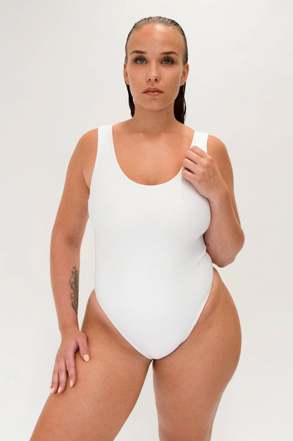 model with white sustainable high cut one piece