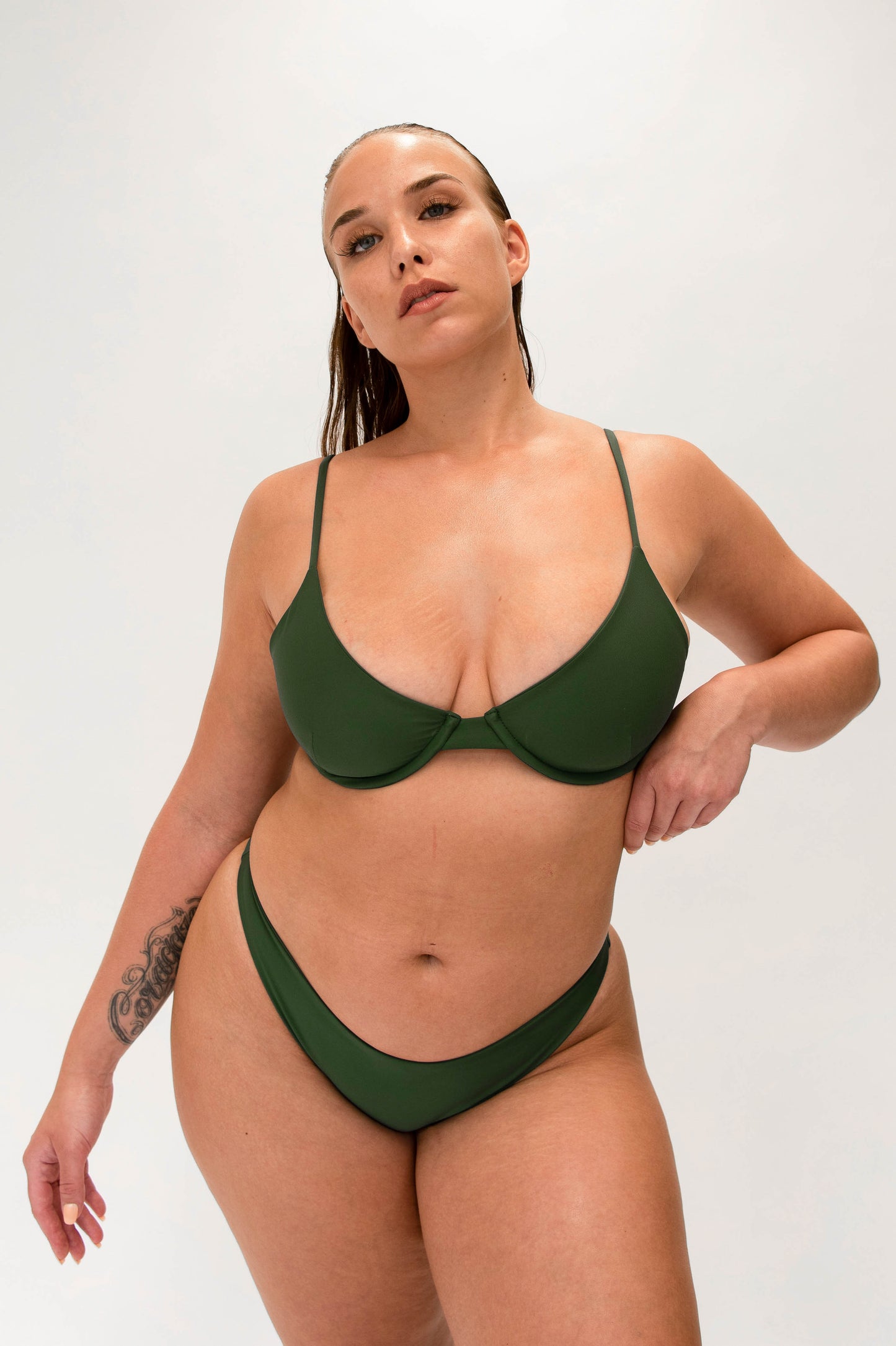 model with green sustainable classy bikini 