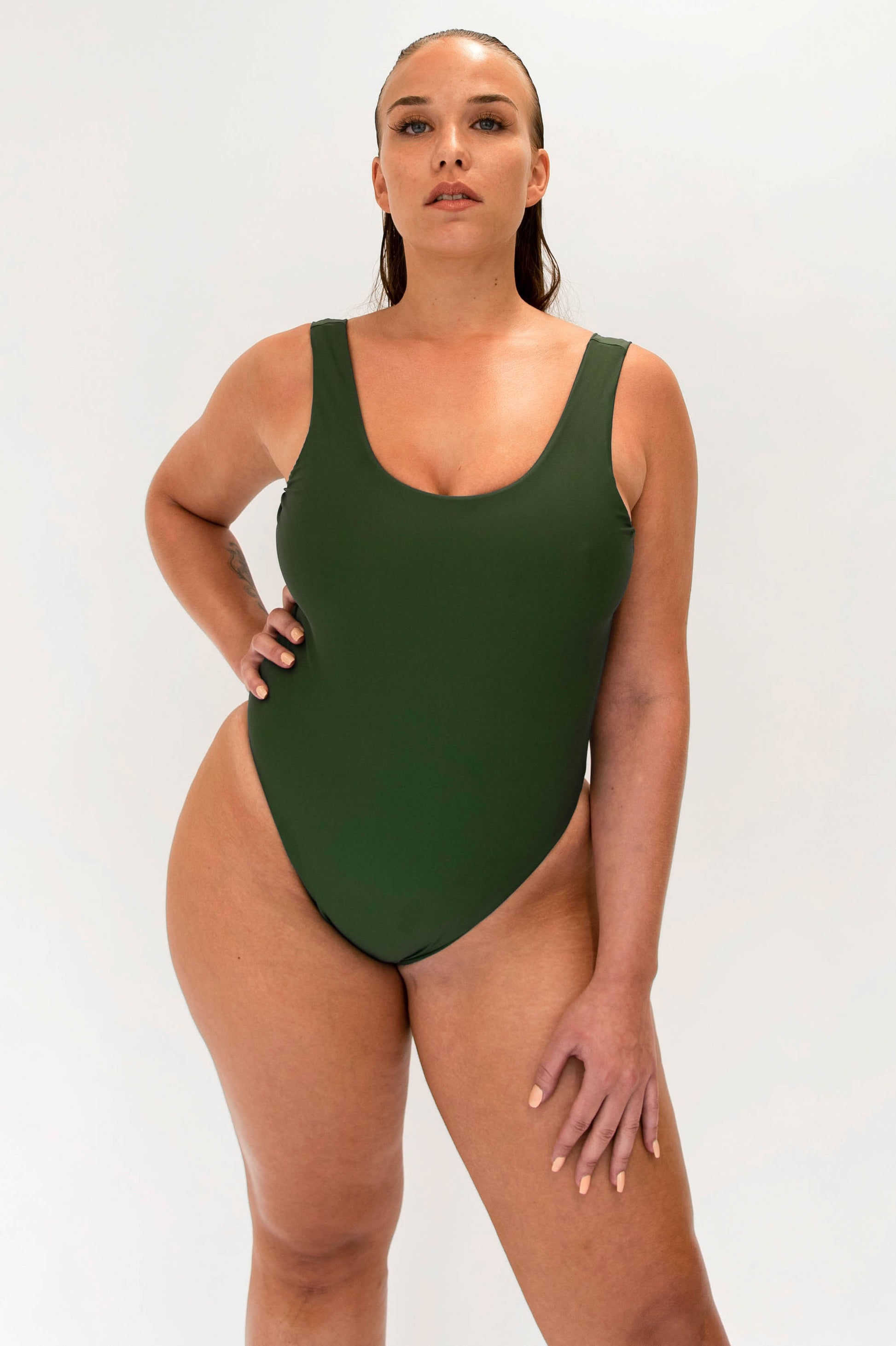 model with green sustainable high cut one piece 