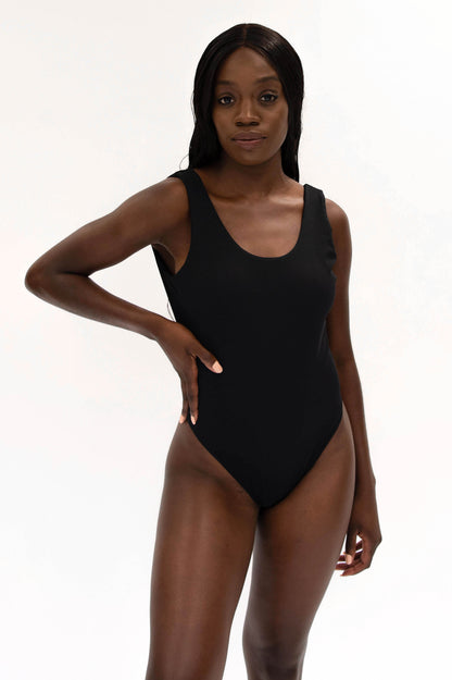 model with recycled black high cut swimsuit