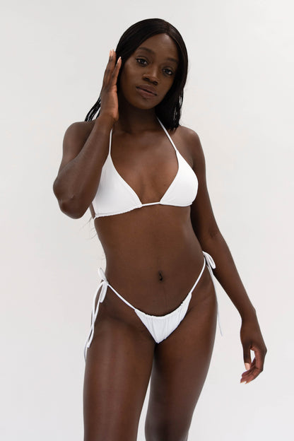 model with sustainable white string bikini