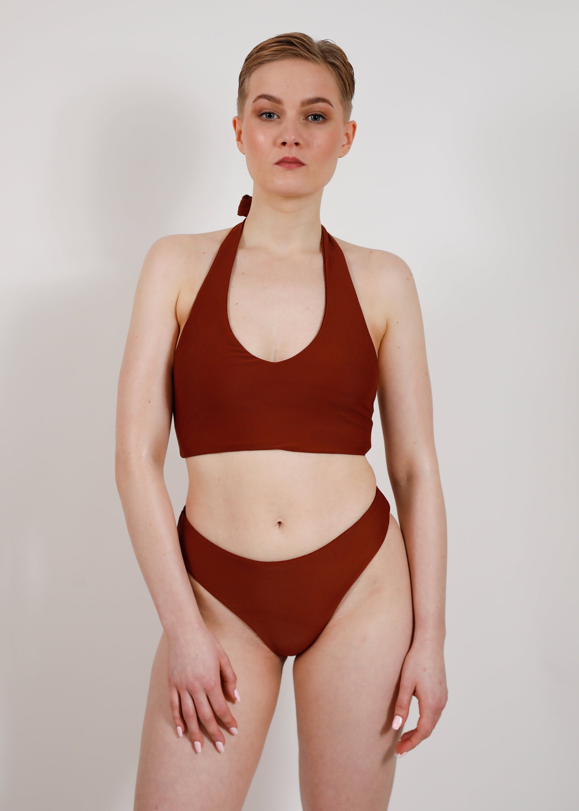 model with sustainable brown tieback bikini top