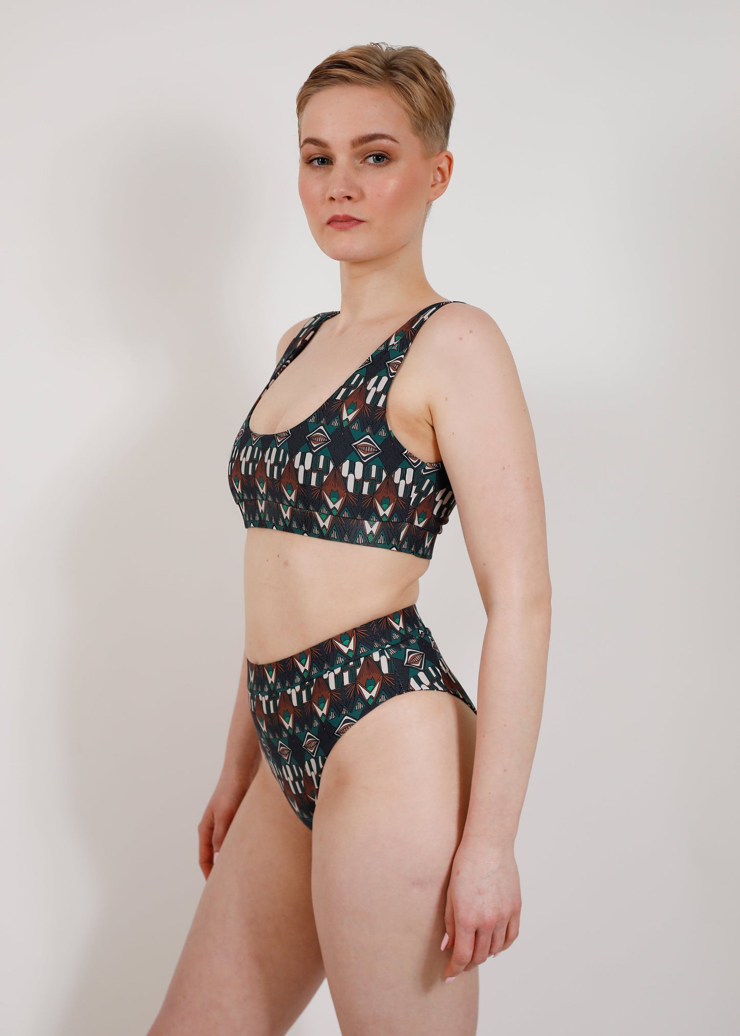 model with sustainable high cut bikini bottom and sporty top 