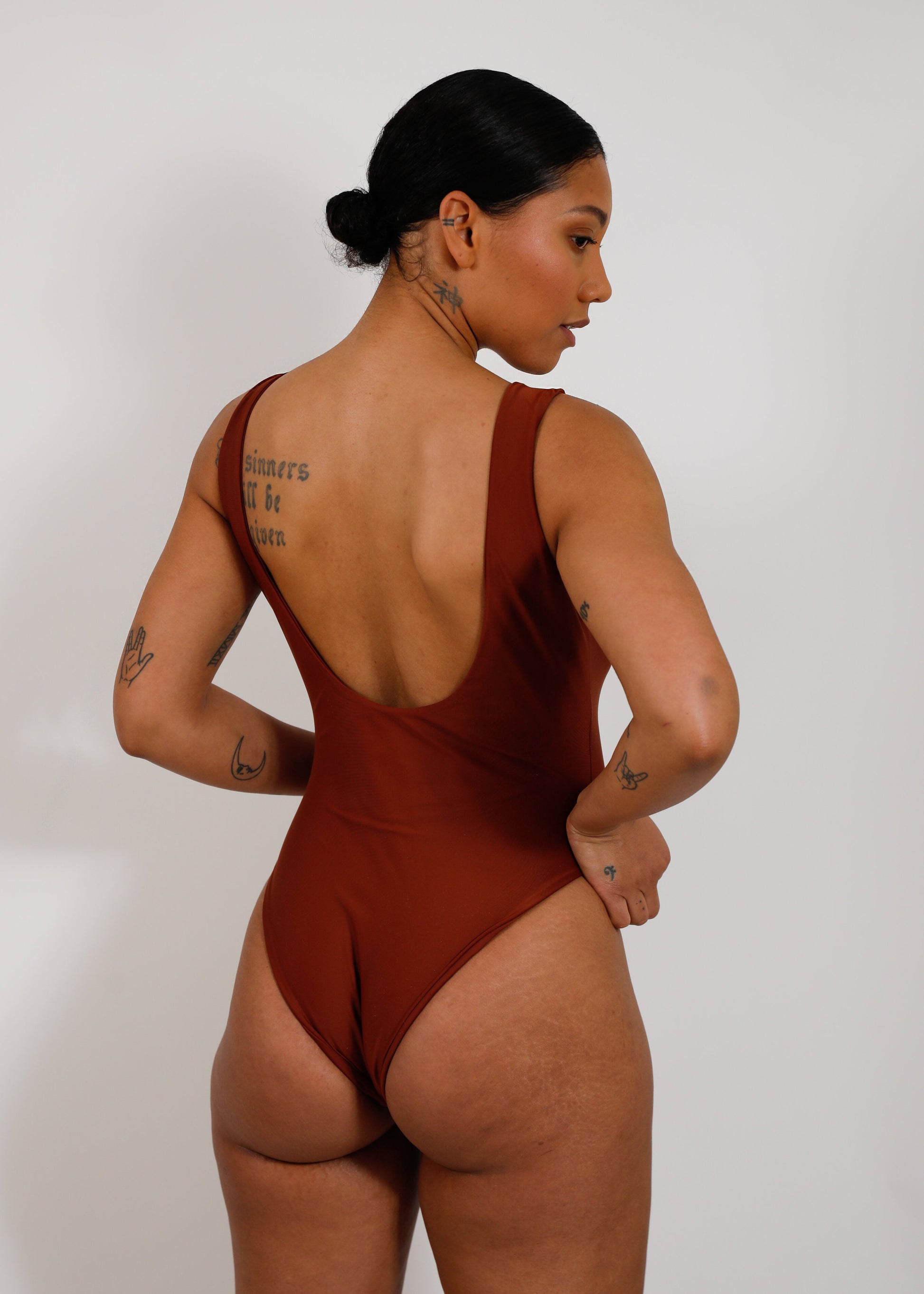 model with brown sustainable high cut one piece