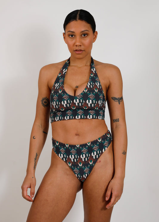 model with sustainable print tieback bikini top